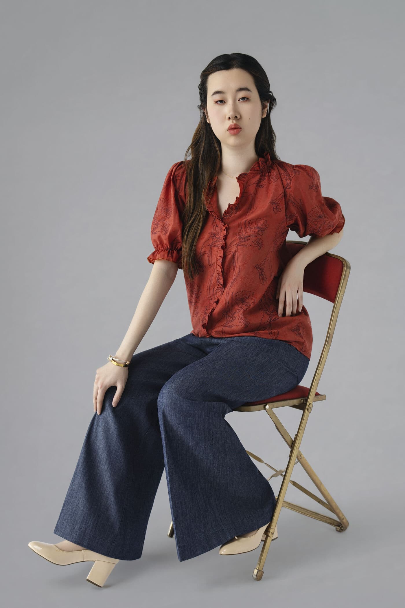 Taana Top — seated, styled with denim